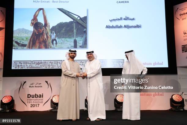 Director Abdullah Aljunaibi with the Muhr Emirati Best Director award for "Camera" with HH Sheikh Mansoor bin Mohammed bin Rashid Al Maktoum and DIFF...