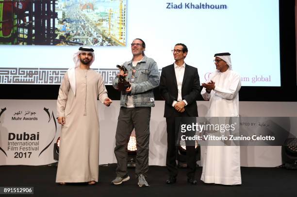 Director Ziad Khalthoum celebrates with the Muhr Best Non Fiction Feature award for "Taste of Cement" with HH Sheikh Mansoor bin Mohammed bin Rashid...