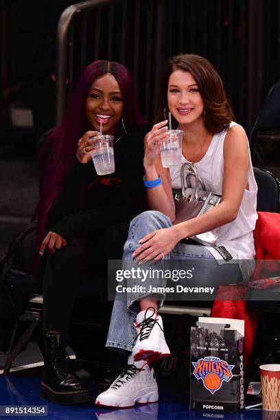 Justine Skye and Bella Hadid attend the Los Angeles Lakers Vs New York Knicks game at Madison Square Garden on December 12, 2017 in New York City.