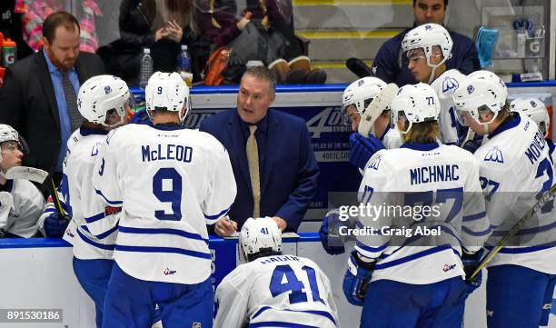 Head coach James Richmond of the Mississauga Steelheads gives instructions to his players during game action against the Hamilton Bulldogs on...