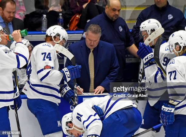 Head coach James Richmond of the Mississauga Steelheads gives instructions to his players during game action against the Hamilton Bulldogs on...