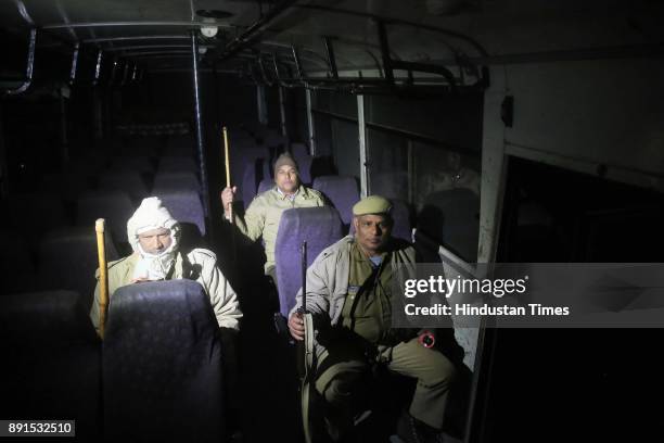 The Police official on duty in their bus at the anti-cow smuggling Mobile Police Post at Amalaki , at Bhiwadi, on intervening night of December 11...