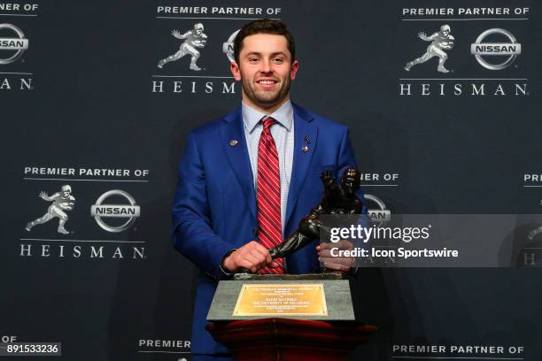 Heisman Trophy Winner University of Oklahoma quarterback Baker Mayfield poses with the Heisman Trophy during the Heisman Trophy Winner Press...