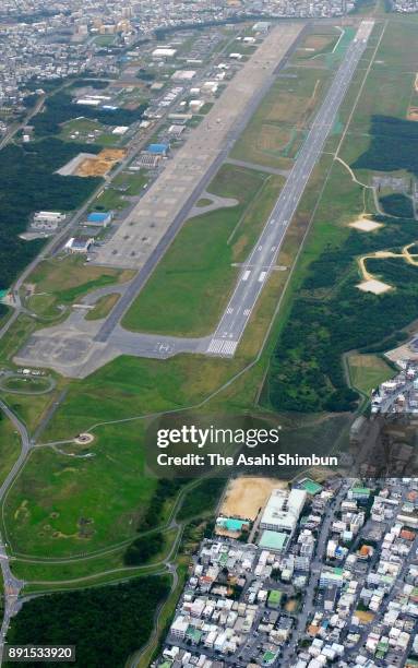 In this aerial image, U.S. Marine Corps Air Station Futenma and Futenma Daini Elementary School are seen on December 13, 2017 in Ginowan, Okinawa,...