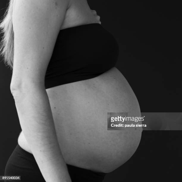 8 month pregnant woman - 8 month pregnant stock pictures, royalty-free photos & images