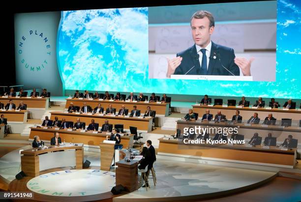 French President Emmanuel Macron delivers a speech at the One Planet Summit in suburban Paris on Dec. 12 two years after the conclusion of the 2015...