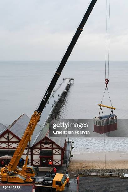 Carriage from the 133-year old funicular cliff lift in Saltburn-By-The-Sea is lifted by crane to be taken away for renovation work on December 13,...