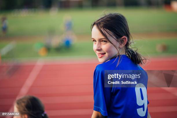 spectating at athletics club - kids track and field stock pictures, royalty-free photos & images