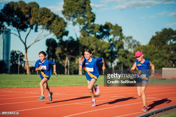 racing at athletics club - kids track and field stock pictures, royalty-free photos & images
