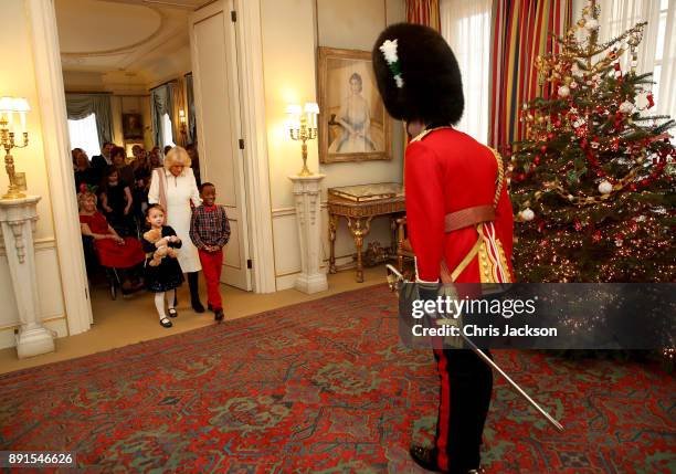 Camilla, Duchess of Cornwall is seen with children from Helen & Douglas House and Roald Dhal's Marvellous Children's Charity decorating the Clarence...