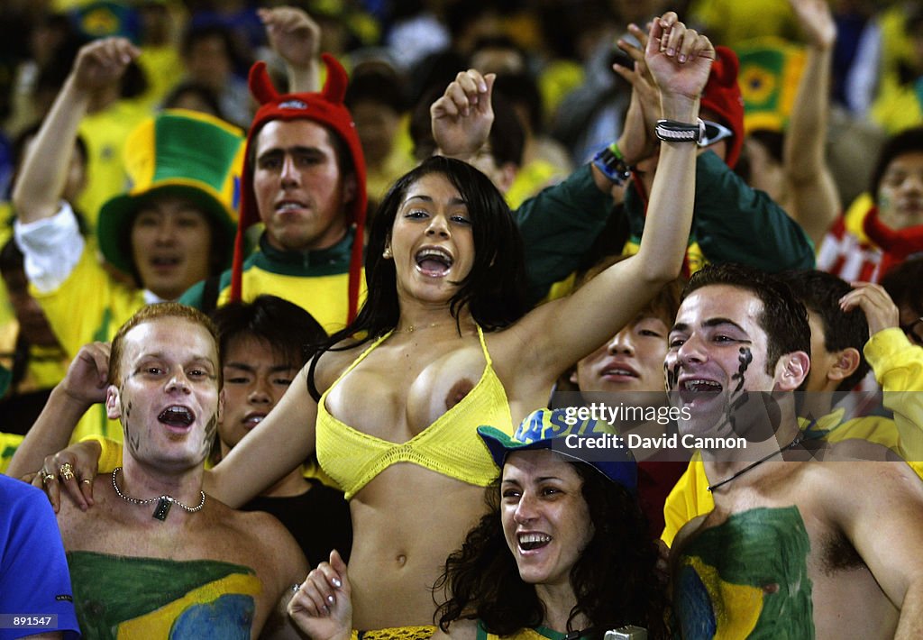 A Brazil fan her top during the FIFA Cup Finals 2002... News Photo - Images