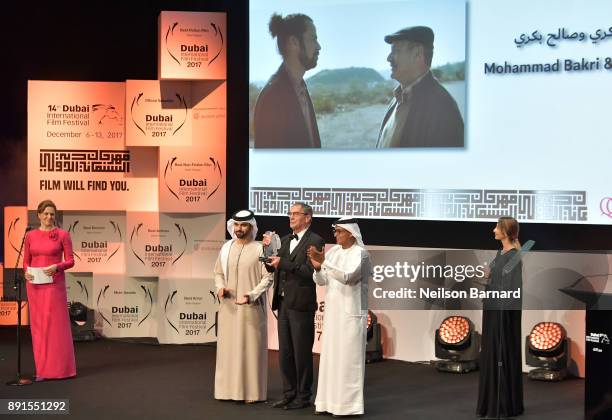 Actor Mohammad Bakri with the Muhr Feature Best Actor award for "Wajib" with HH Sheikh Mansoor bin Mohammed bin Rashid Al Maktoum and DIFF Chairman...