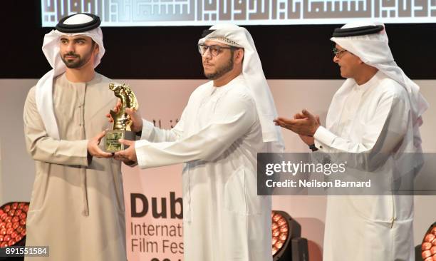 Director Yaser Al Neyadi with the Muhr Emirati Best Short award for "Escape" with HH Sheikh Mansoor bin Mohammed bin Rashid Al Maktoum and DIFF...