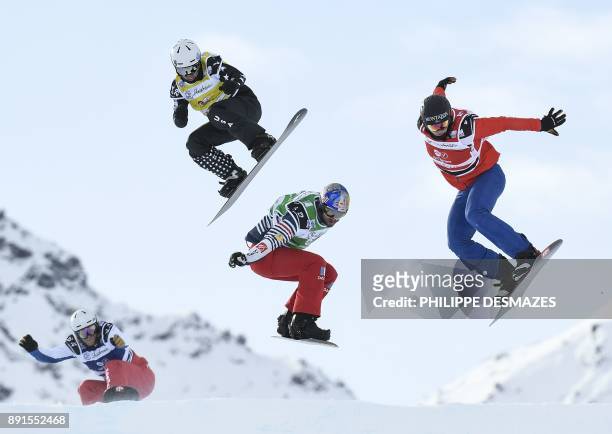 Italy's Fabio Corbi , Spain's Regino Hernandez , US snowboarder Nate Holland and Australia's Alex Pullin compete in the FIS Snowboard Cross Women...