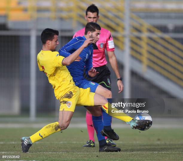 Manolo Portanova of Italy U18 competes for the ball with Ricardo Farcas of Romania U18 during the international friendly match between Italy U18 and...