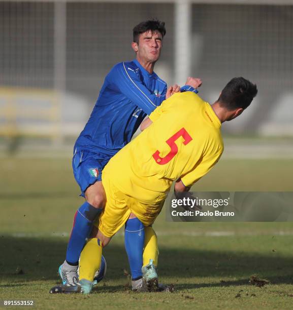 Gabriele Ferrarini of Italy U18 competes for the ball with Ricardo Farcas of Romania U18 during the international friendly match between Italy U18...