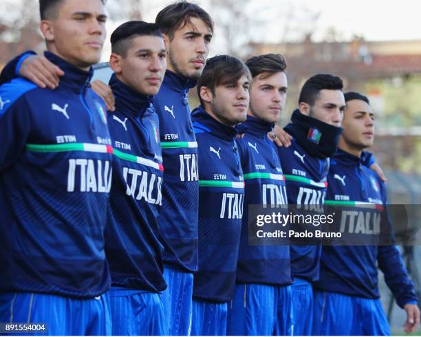 Italian players sing their national anthem during the international friendly match between Italy U18 and Romania U18 on December 13, 2017 in Viterbo,...