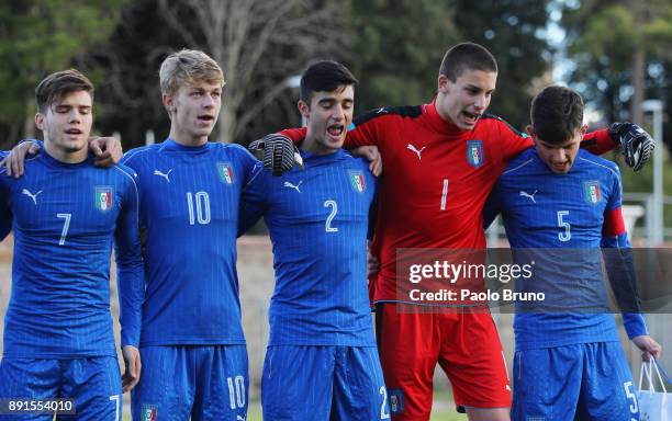 Italian players sing their national anthem during the international friendly match between Italy U18 and Romania U18 on December 13, 2017 in Viterbo,...