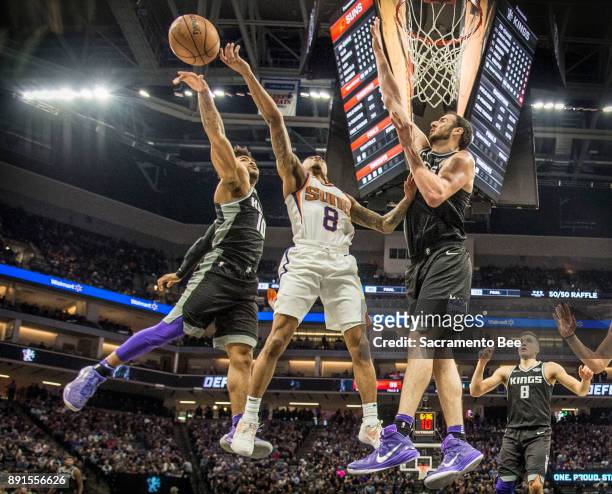 Sacramento Kings guard Frank Mason III strips the ball from Phoenix Suns guard Tyler Ulis as he drives to the basket as teammate Sacramento Kings...