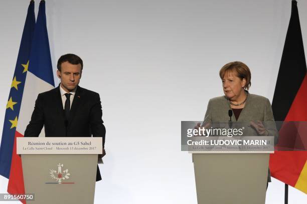 German Chancellor Angela Merkel and France's President Emmanuel Macron take part in a press conference on December 13, 2017 at La Celle-Saint-Cloud,...