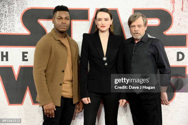 John Boyega, Daisy Ridley and Mark Hamill attend the 'Star Wars: The Last Jedi' photocall at Corinthia Hotel London on December 13, 2017 in London,...