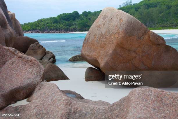 seychelles, la digue island, anse cocos, big rocks on the beach - cocos island stockfoto's en -beelden