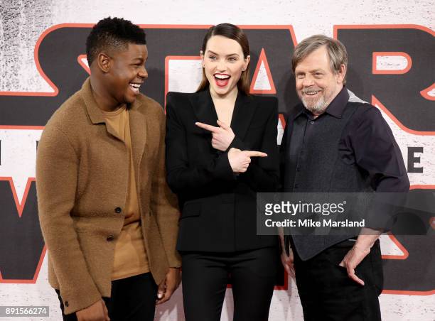 John Boyega, Daisy Ridley and Mark Hamill attend the 'Star Wars: The Last Jedi' photocall at Corinthia Hotel London on December 13, 2017 in London,...
