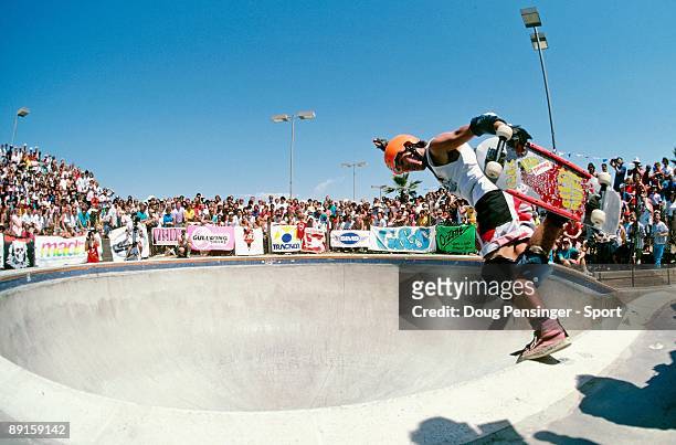 Billy Ruff, riding for Gordan and Smith Skateboards, does a backside boneless in the keyhole pool during competition at the National Skateboarding...