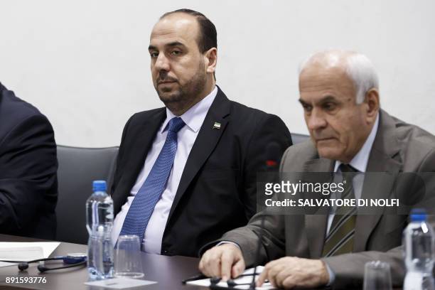 Nasr al-Hariri Head of the Syrian Negotiation Commission, SNC, and a member of the SNC attend a round of negotiations with the UN Special Envoy of...