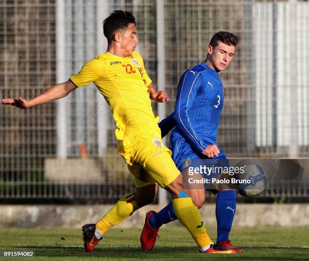 Axel Campeol of Italy U18 competes for the ball with Levent Oltay of Romania U18 during the international friendly match between Italy U18 and...