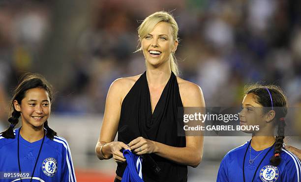 Actress Charlize Theron from South Africa attends the 2009 World Football Challenge game Chelsea FC vs Inter Milan, at the Rose Bowl stadium in...
