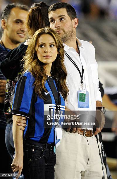 Recently engaged actress Alyssa Milano and Fiance Dave Bugliari follows the action on the soccer pitch during a friendly match bewteen Chelsea FC and...