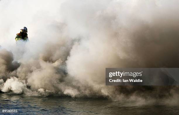 The remains of motorcruisers blaze at Sirsi Marina on July 22, 2009 on Pittwater at Newport on Sydney's Northern Beaches, Australia. At least five...