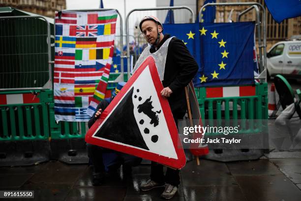 Anti-brexit demonstrators gather with European Union flags outside the Houses of Parliament on December 13, 2017 in London, England. MPs are debating...