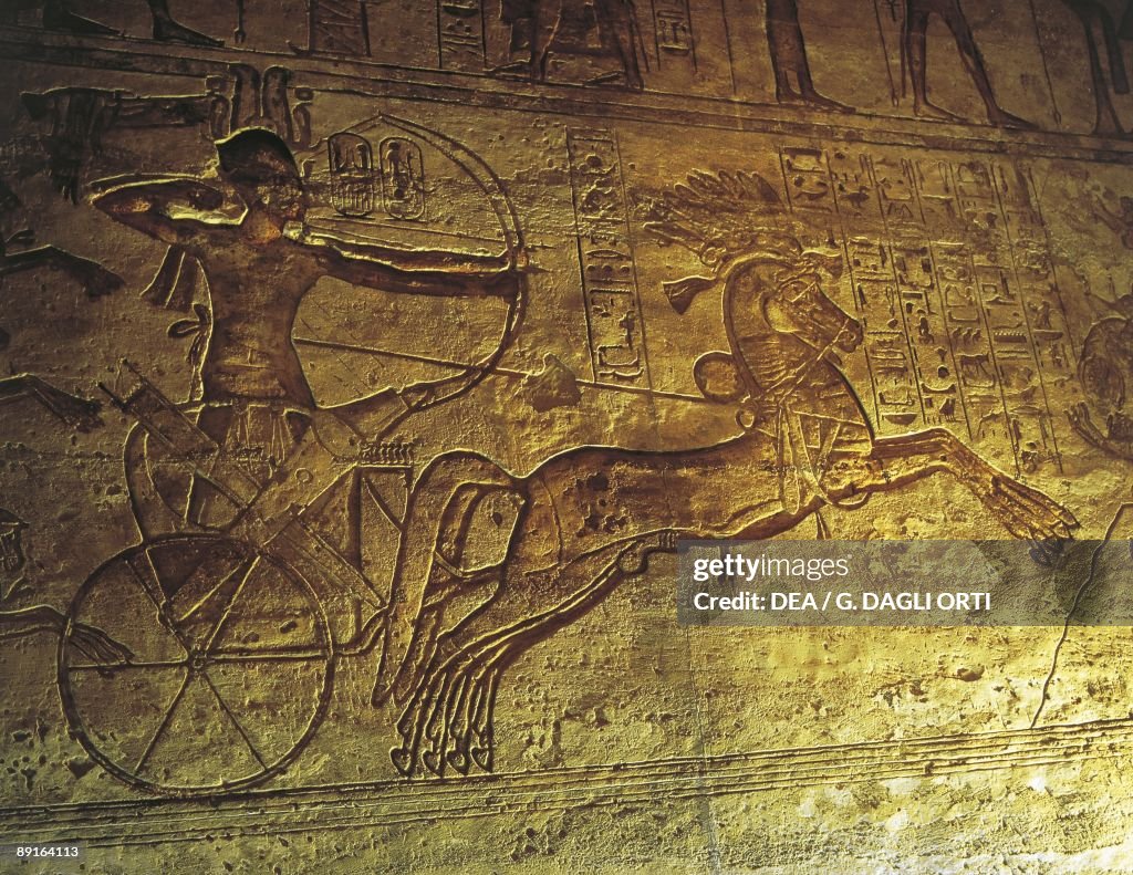Egypt - Lower Nubia - Nubian monuments at Abu Simbel (UNESCO World Heritage Site, 1979). Great temple of Ramses II. Reliefs, detail showing Ramses II atop chariot at the battle of Qadesh