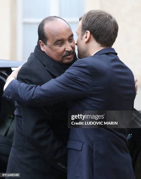 Mauritania's President Mohamed Ould Abdel Aziz is welcomed by French President Emmanuel Macron upon at his arrival for a summit from the underfunded...