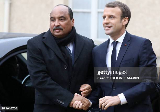 Mauritania's President Mohamed Ould Abdel Aziz is welcomed by French President Emmanuel Macron upon at his arrival for a summit from the underfunded...