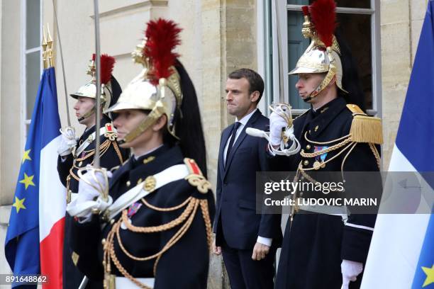 French president Emmanuel Macron stands at the entrance of the castle of la Celle Saint cloud for a summit from the underfunded G5 Sahel anti-terror...