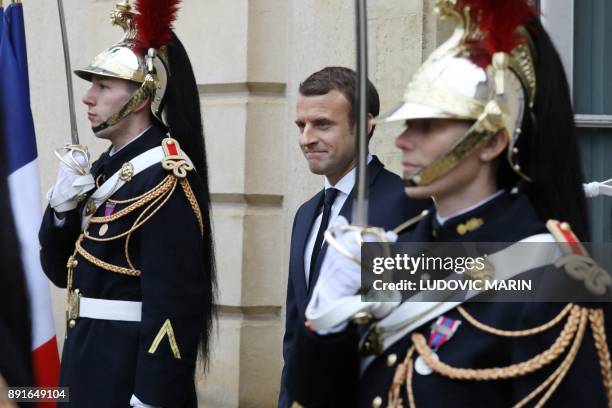 French president Emmanuel Macron stands at the entrance of the castle of la Celle Saint cloud for a summit from the underfunded G5 Sahel anti-terror...