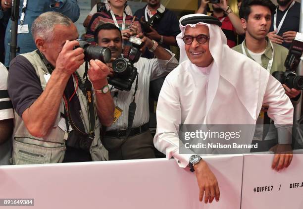 Chairman Abdulhamid Juma joins the photographers at the "Star Wars: The Last Jedi" Closing Night red carpet on day eight of the 14th annual Dubai...