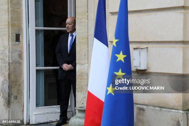 French foreign affairs minister Jean Yves Le Drian stands at the entrance of the castle of la Celle Saint cloud for a summit from the underfunded G5...