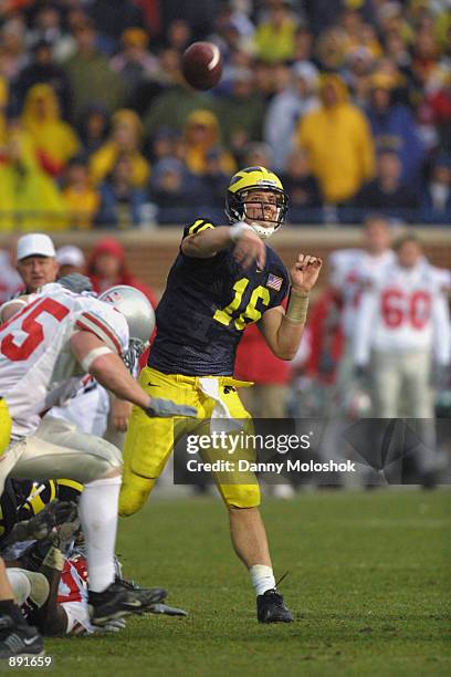 Quarterback John Navarre of the Michigan Wolverines throws a pass during the Big Ten Conference football game against the Ohio State Buckeyes on...