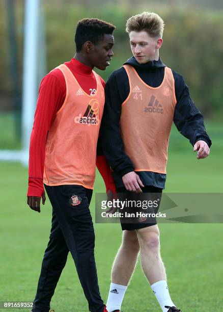 Denver Hume chats with Joel Asoro during a Sunderland training session at The Academy of Light on December 13, 2017 in Sunderland, England.