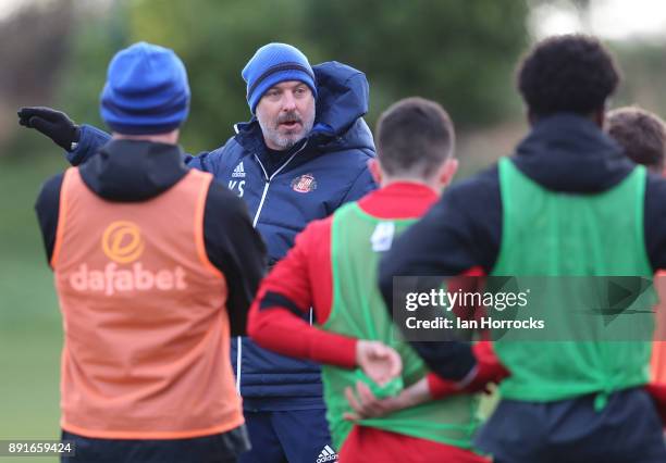 Assistant manager Kit Symons gives instruction during a Sunderland training session at The Academy of Light on December 13, 2017 in Sunderland,...