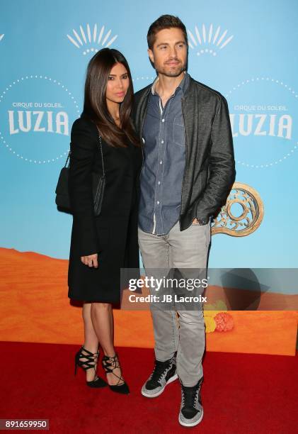 Roselyn Sanchez and Eric Winter attend Cirque du Soleil presents the Los Angeles premiere event of 'Luzia' at Dodger Stadium on December 12, 2017 in...