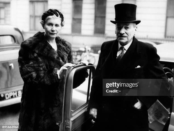 British former Prime Minister Clement Attlee accompanied by his wife Violet arrives at Courtfield Gardens in London for his formal introduction to...