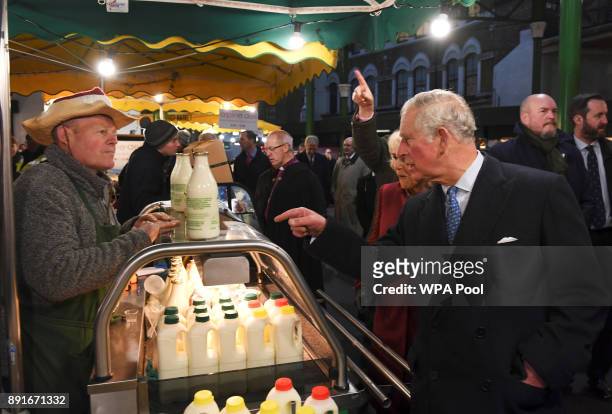 Camilla, Duchess of Cornwall and Prince Charles, Prince of Wales visit Borough Market on December 13, 2017 in London, England.