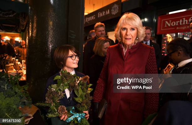 Camilla, Duchess of Cornwall, visits Borough Market on December 13, 2017 in London, England.