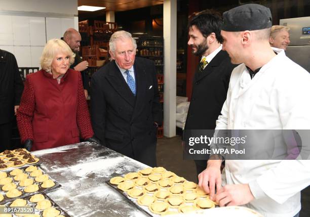 Camilla, Duchess of Cornwall and Prince Charles, Prince of Wales visit Borough Market on December 13, 2017 in London, England.