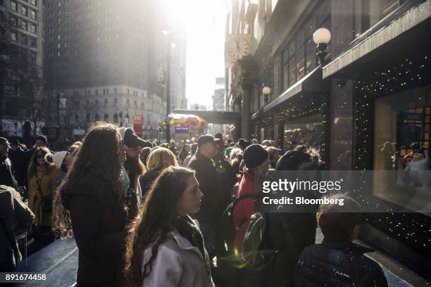 Pedestrians view a holiday window display at the Macy's Inc. Department store in New York, U.S., on Sunday, Dec. 10, 2017. Bloomberg is scheduled to...